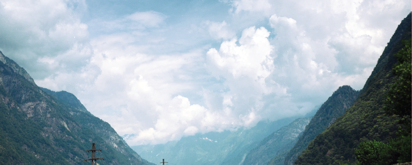mountains and puffy white clouds