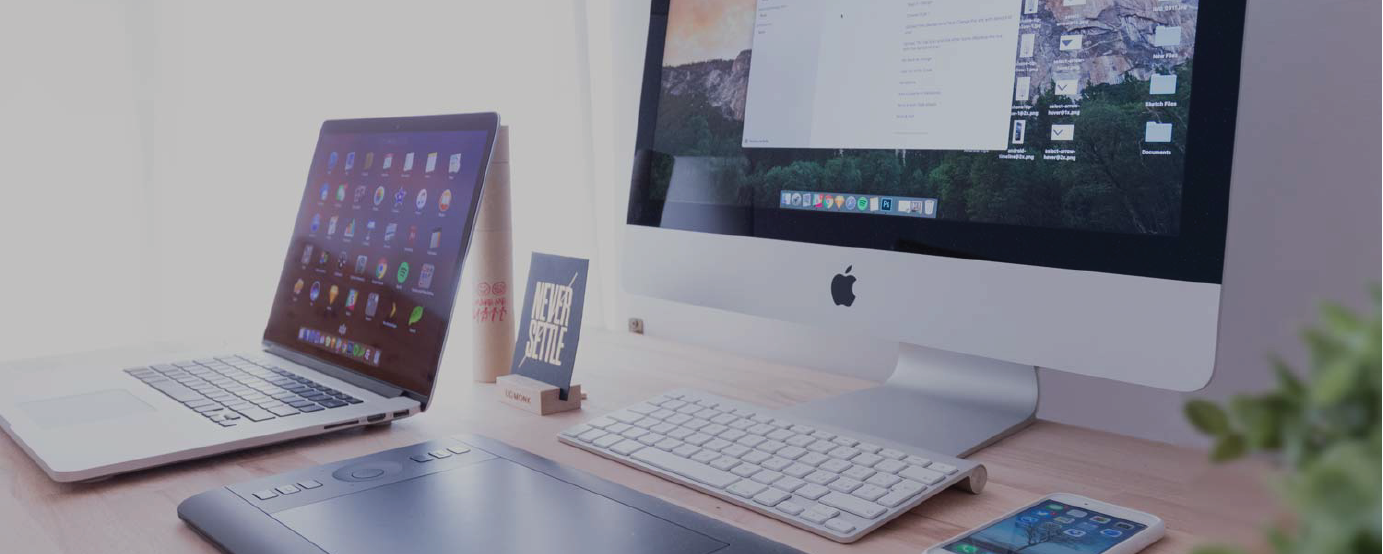 two laptops open on desk