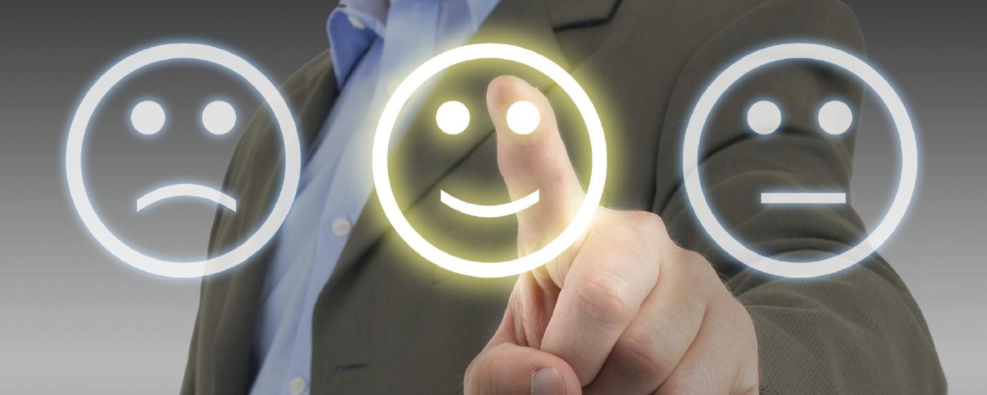 three emojis - happy, sad, neutral finger of person not visible choosing happy