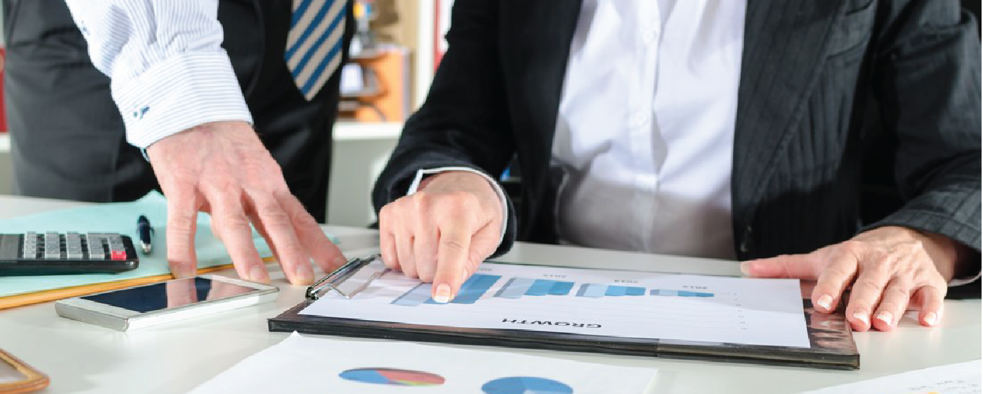 Business people looking at chart