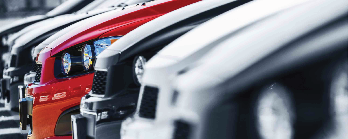cars in row only front hoods partially visible all dark one red one