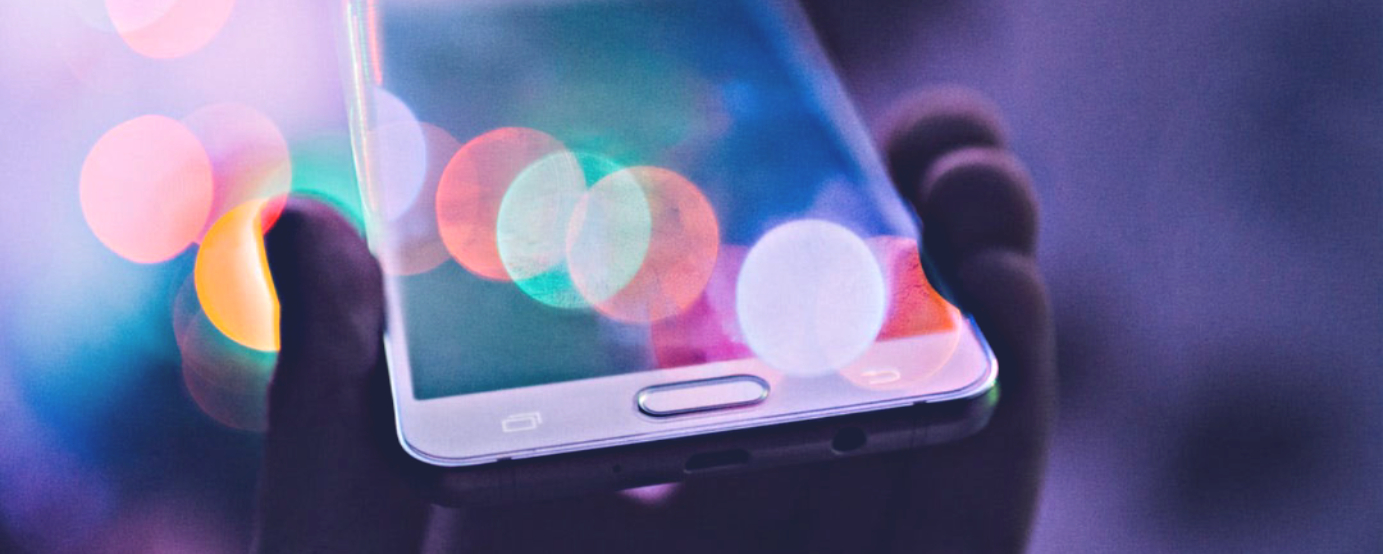 person holding phone to depict technology