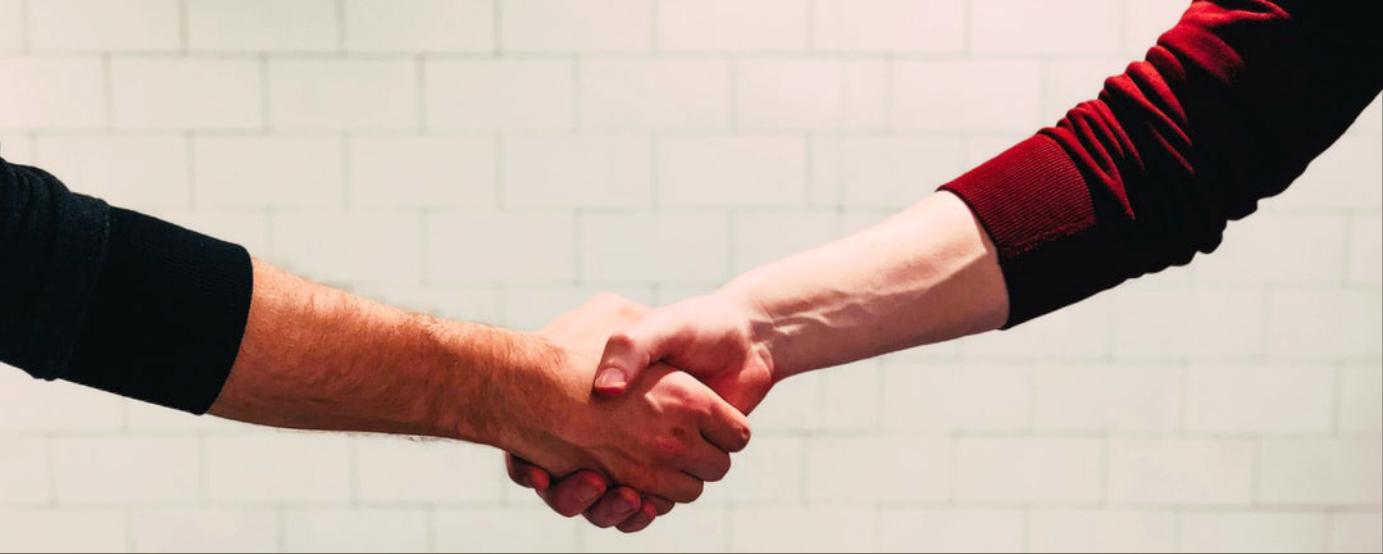 Handshake between two people who are not visible