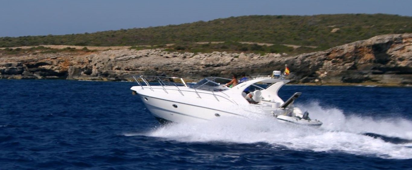 Boat careening through the water making waves