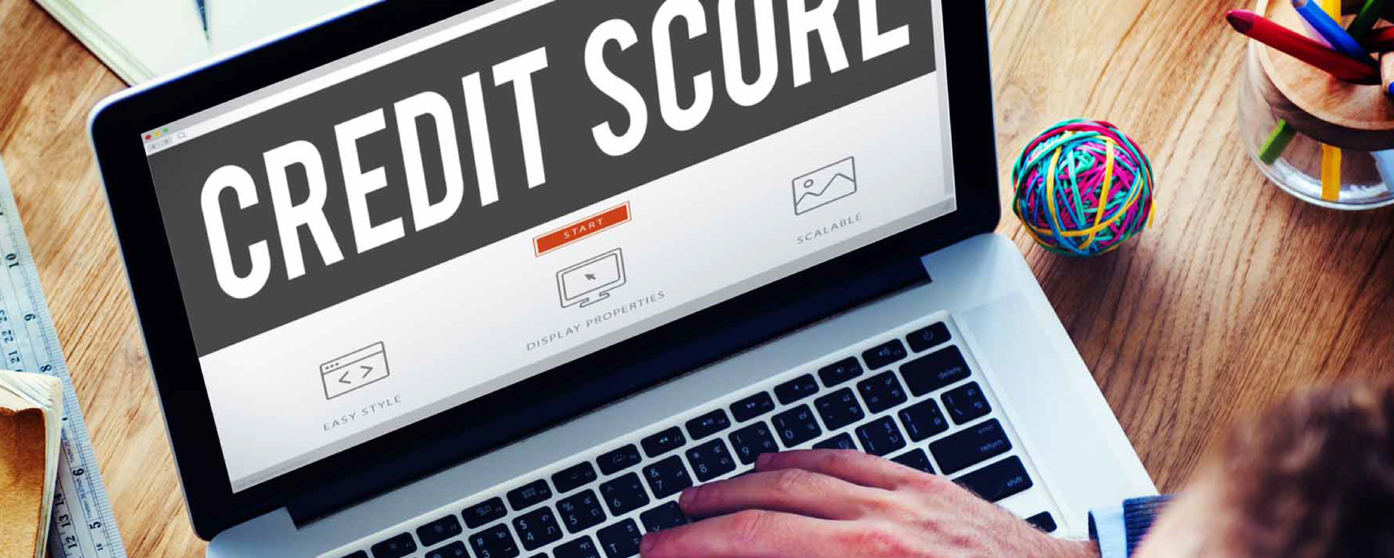 Photo of laptop with the words Credit Score visible on screen.