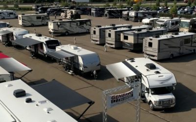 Photo of RVs in dealership lot.
