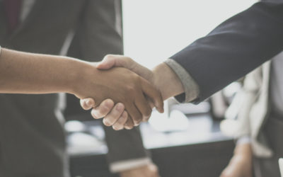 Picture showing handshake between two people who are not visible.